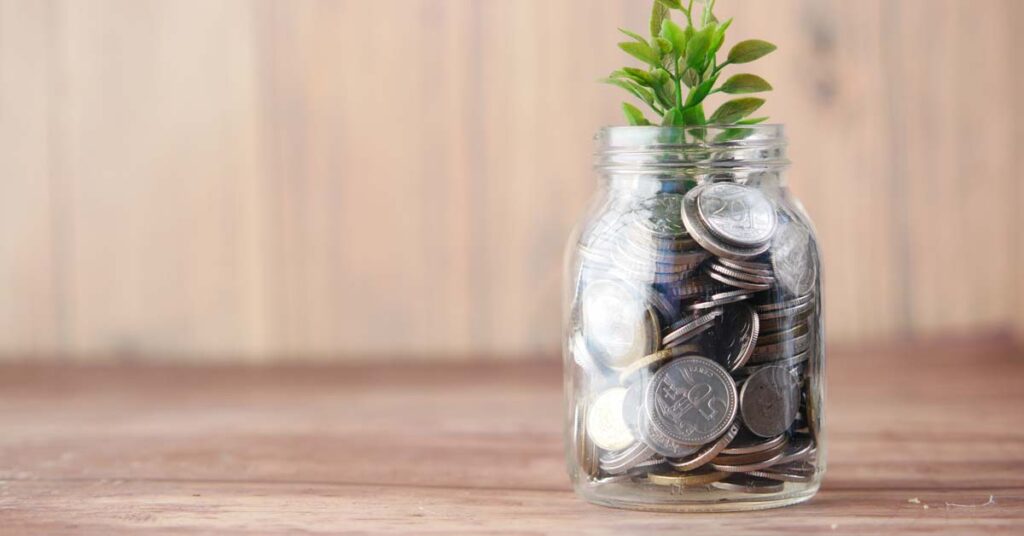 Coin jar with plant on top
