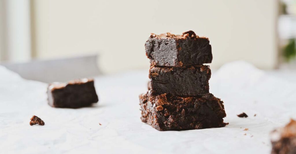 Freshly baked chocolate brownies on a bench