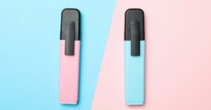 Pink and blue highlighters on two tone background