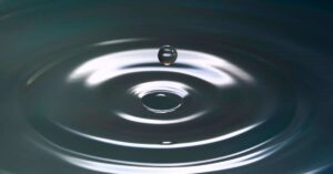 A Water droplet on a ripple of tiny waves in water