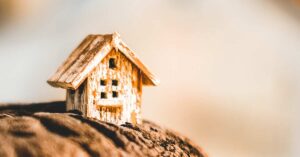 Close up of a small doll house made from wood